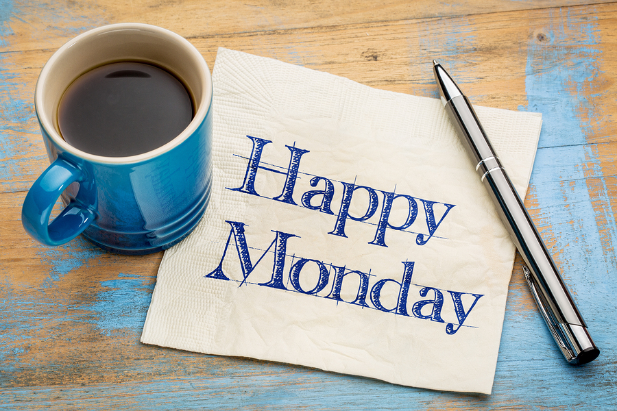 Happy Monday -  cheerful handwriting on a napkin with a cup of c